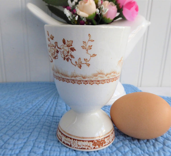 Unusual brown vintage double egg cup with double boiled egg holder