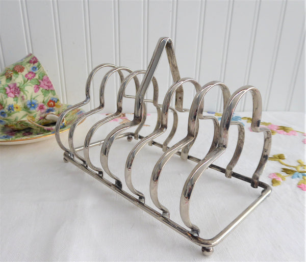 http://www.antiquesandteacups.com/cdn/shop/products/1930s-English-toast-rack-holder-silverplate-gothic-c_grande.jpg?v=1596228210
