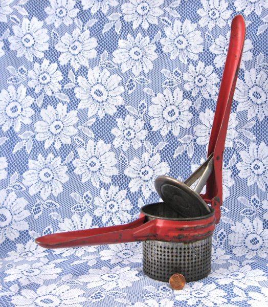 http://www.antiquesandteacups.com/cdn/shop/products/1940s-ricer-mill-original-red-paint-gadget-b_grande.jpg?v=1651506197