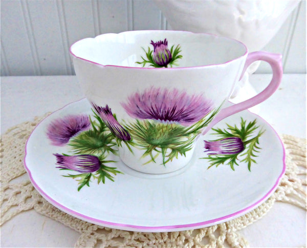 http://www.antiquesandteacups.com/cdn/shop/products/1950s-Shelley-Thistle-CupAndSaucer-Cambridge-Pink-Trim-a_grande.jpg?v=1652912444