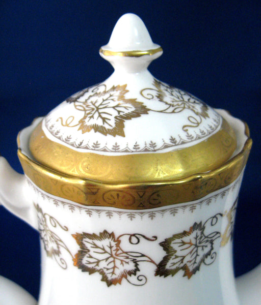 http://www.antiquesandteacups.com/cdn/shop/products/1970s-RoyalTuscan-fancy-gold-coffeepot-teapot-b_grande.jpg?v=1554574634