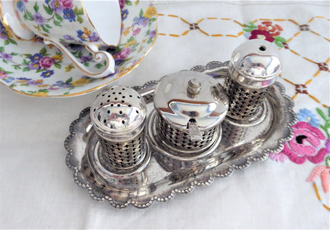 https://www.antiquesandteacups.com/cdn/shop/products/1960s-silverplate-condiment-set-cobalt-liners-UK-a_large.jpg?v=1587349148